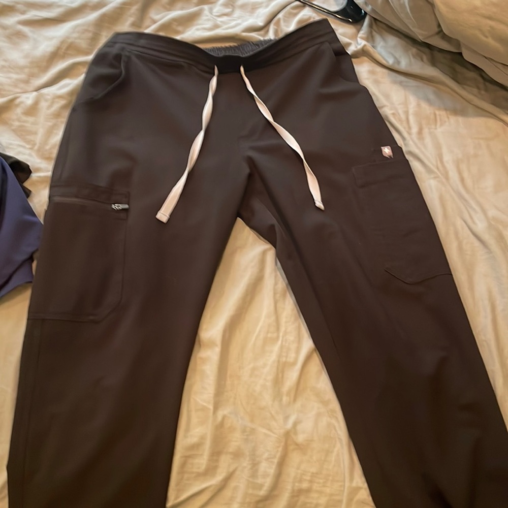Figs black scrub top and pants size small. Figs medium scrub top blue.